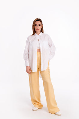 Loose white shirt with long sleeves