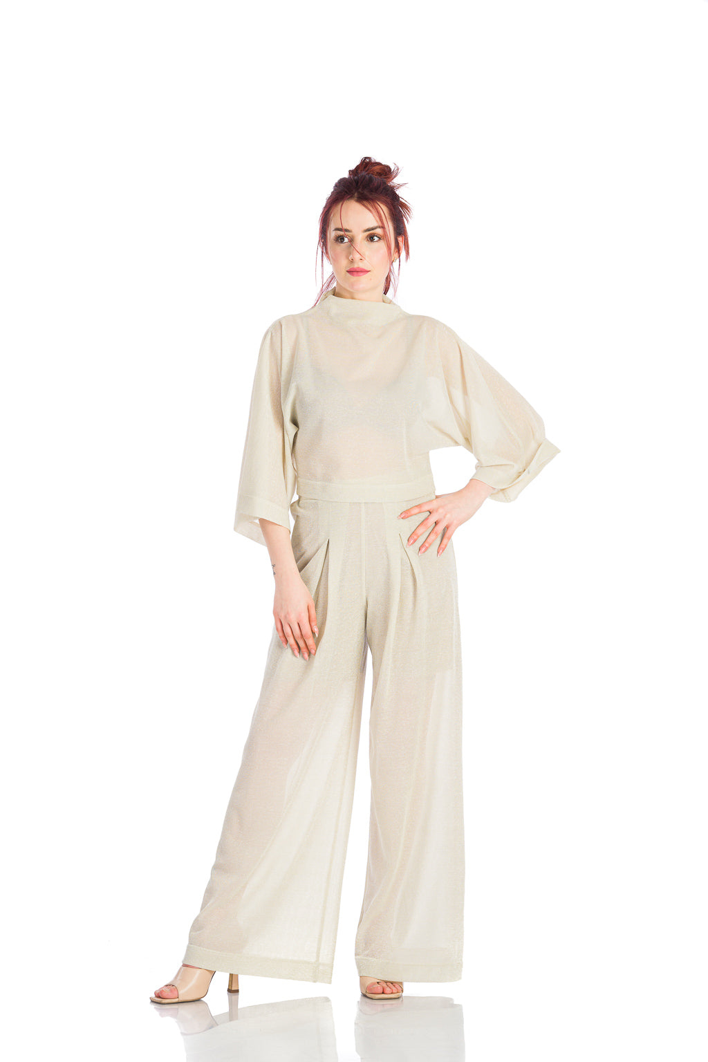 Pants in beige mesh with a loose design Pants in beige mesh with a loose design