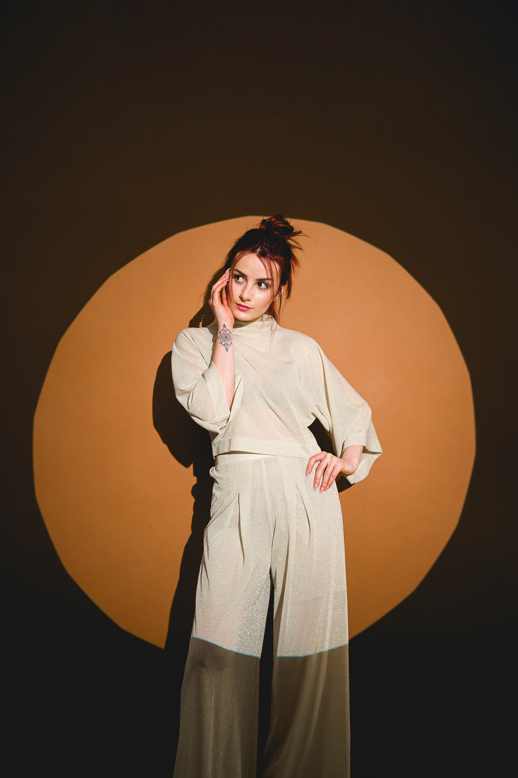 Pants in beige mesh with a loose design Pants in beige mesh with a loose design