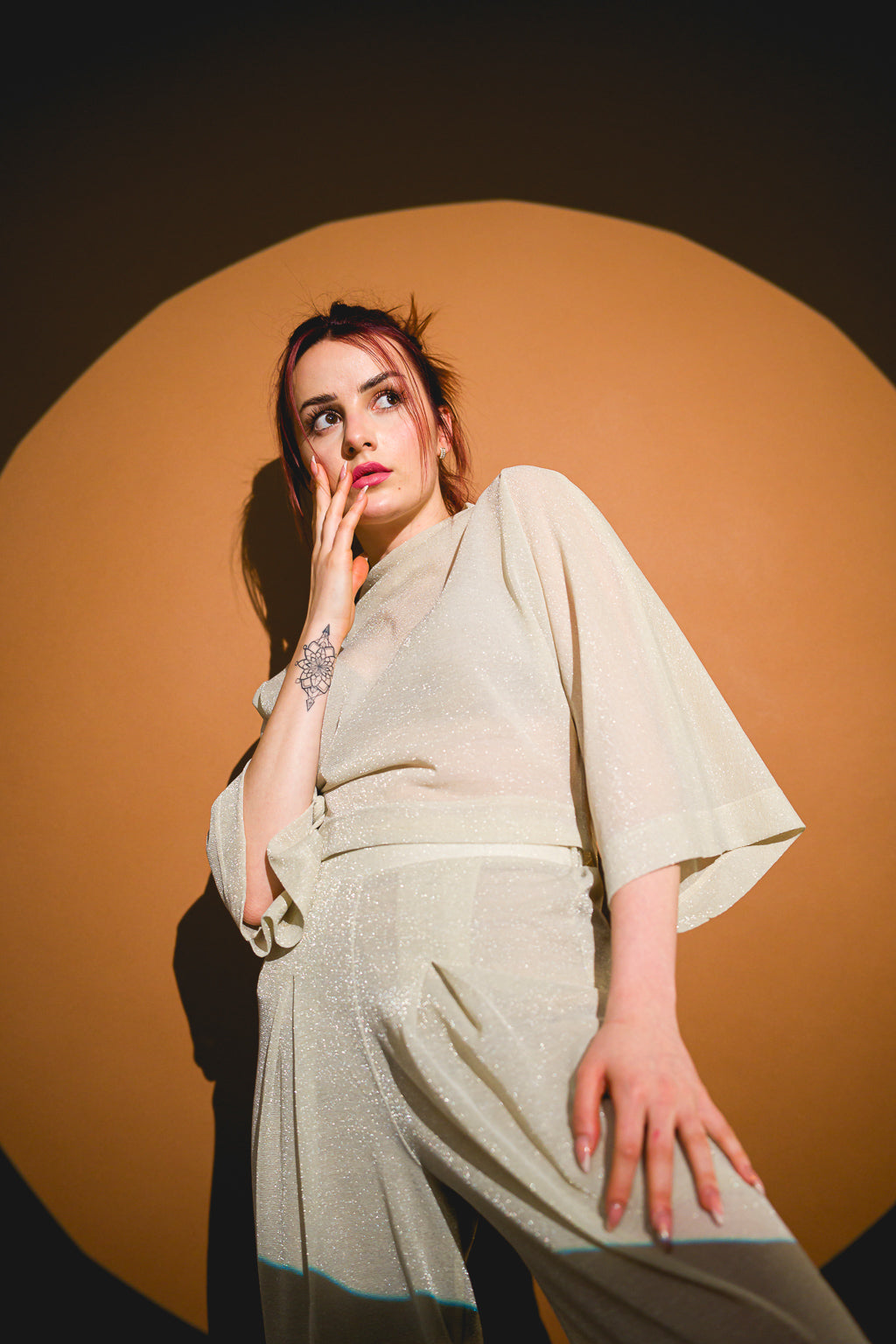 Pants in beige mesh with a loose design Pants in beige mesh with a loose design