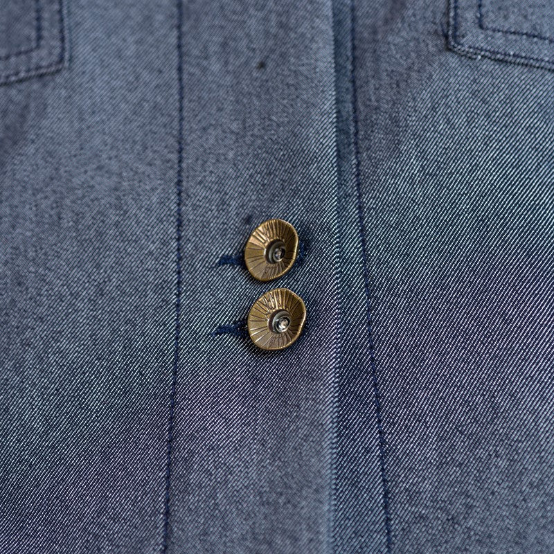 Giubbino corto con arricciatura sul davanti in colore blu scuro Giubbino corto con arricciatura sul davanti in colore blu scuro