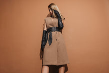 Sleeveless coat in brown rips