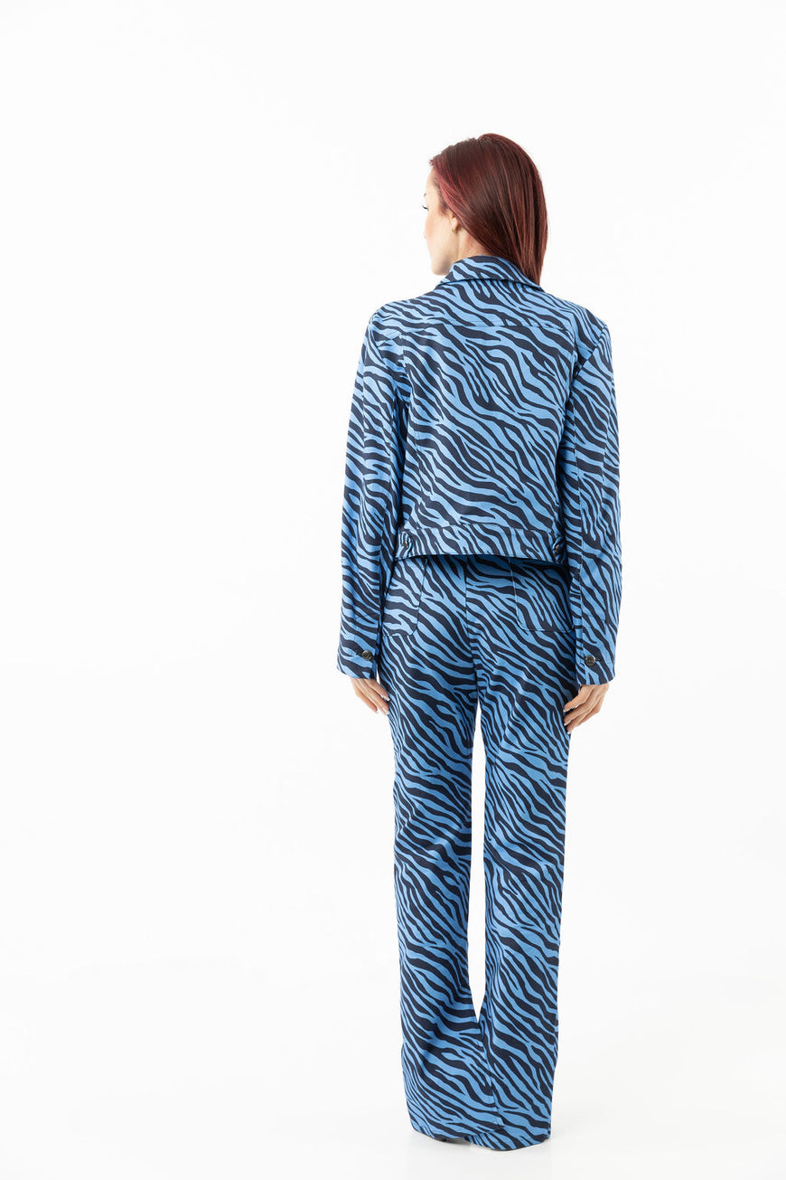 Pants in a blue zebra print with leg openings