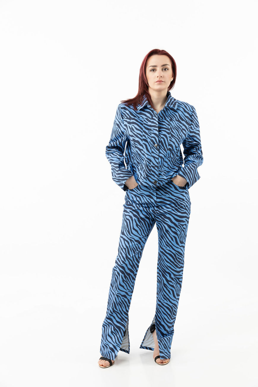 Pants in a blue zebra print with leg openings