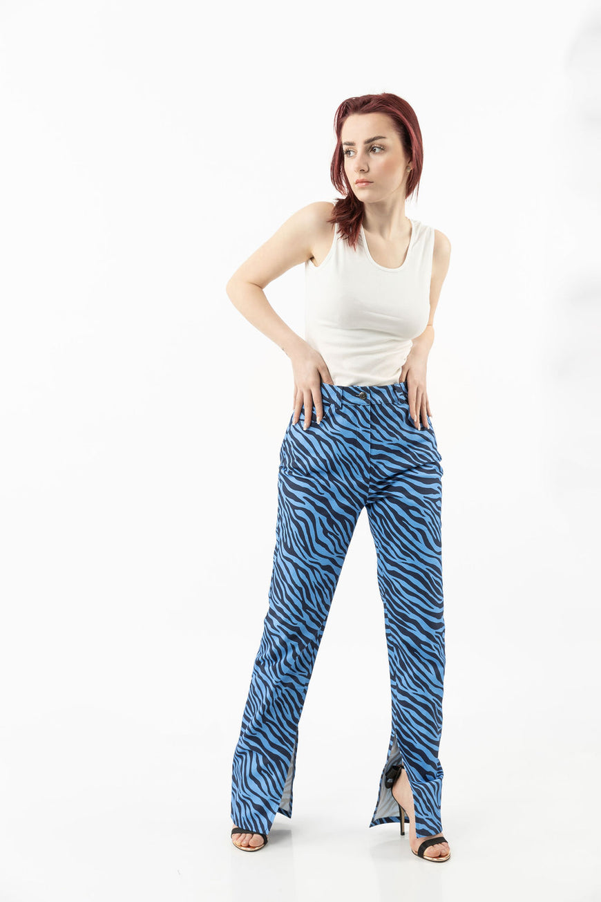 Pants in a blue zebra print with leg openings