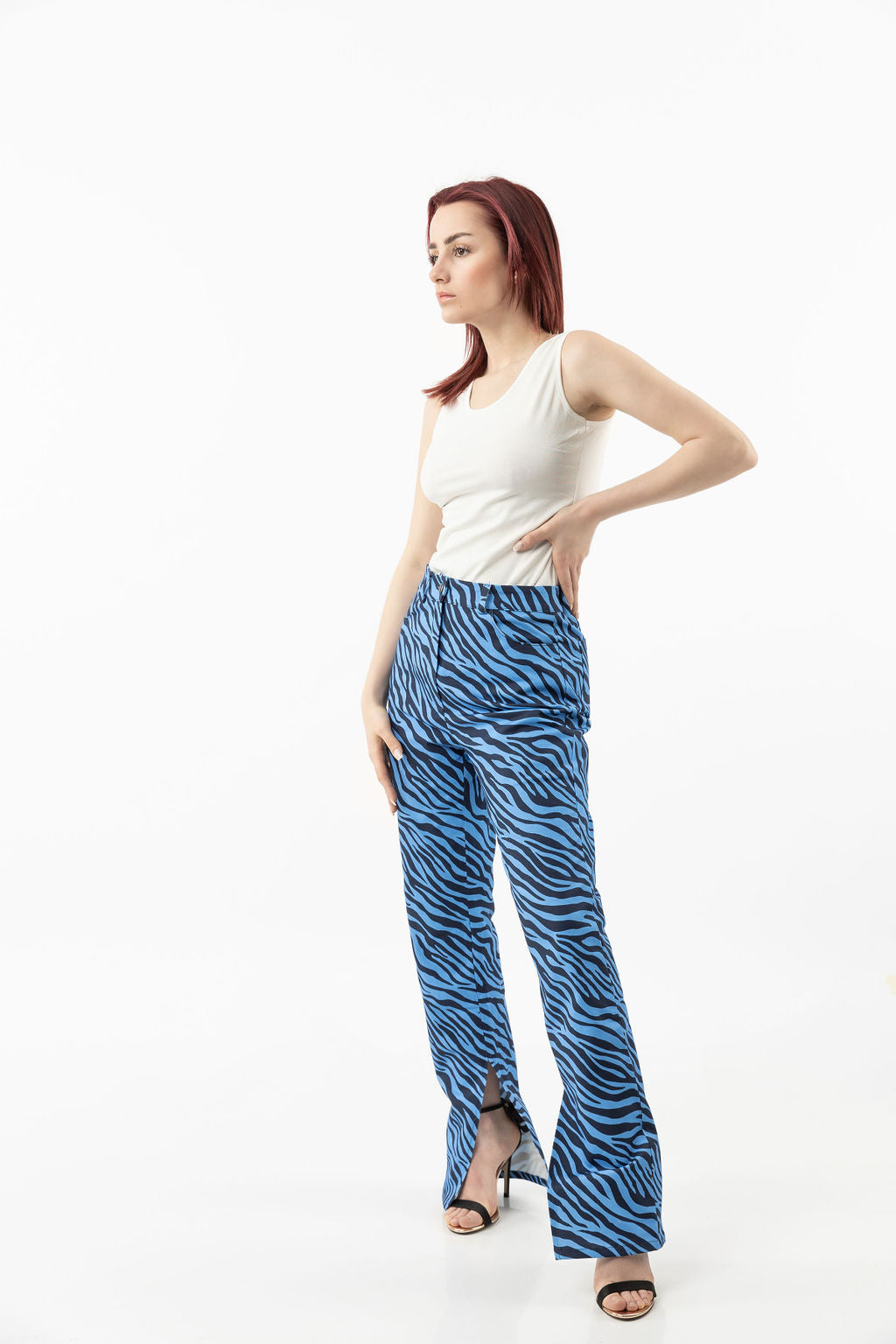 Pants in a blue zebra print with leg openings