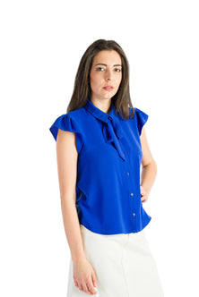 Sleeveless shirt with ruffles in blue