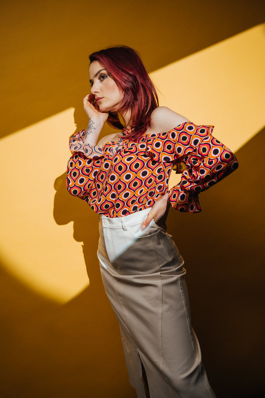 Off-shoulder orange blouse with ruffles