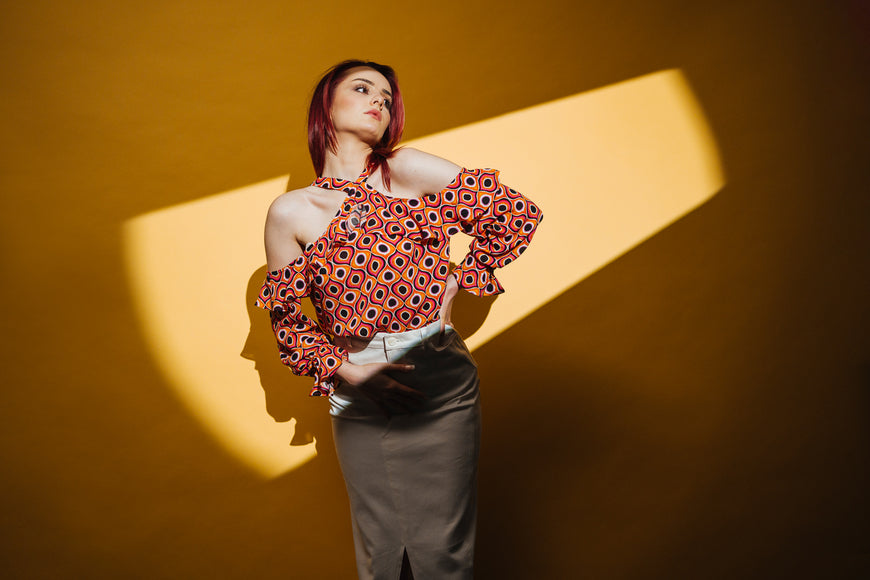 Off-shoulder orange blouse with ruffles