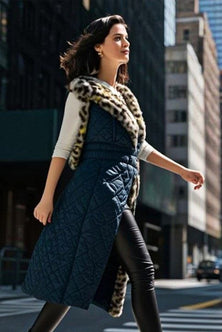 Sleeveless knee-long Jacket in blue, accomplished with eco leopard print feather
